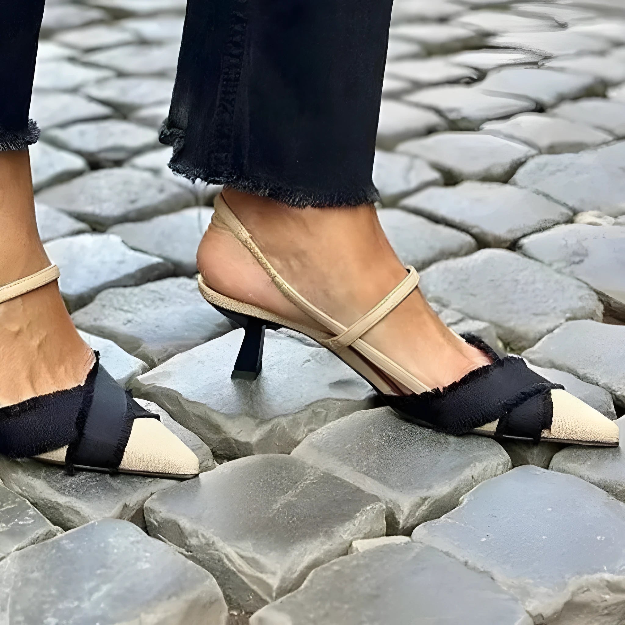 Women's apricot and black colour block pointed-toe stiletto sandals with a buckle strap.