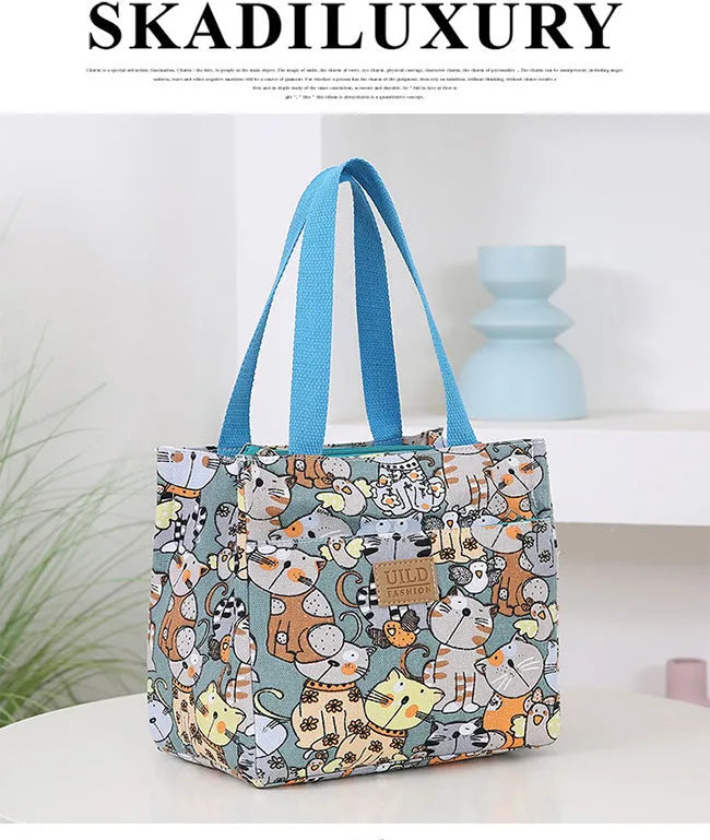Women's printed canvas handbag with aluminium frame in horizontal square shape