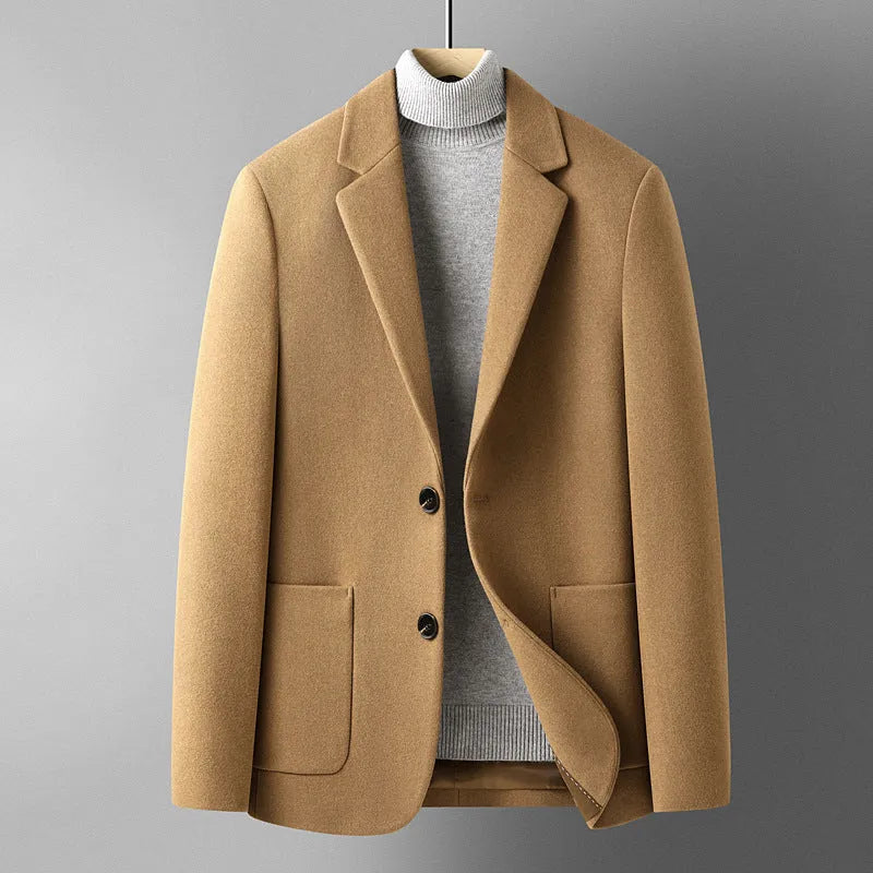 Men's slim fit wool suit jacket in grey, shown on a model, featuring a notched lapel and button front.