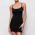 Black sleeveless sling dress with a slim sheath fit and short skirt.