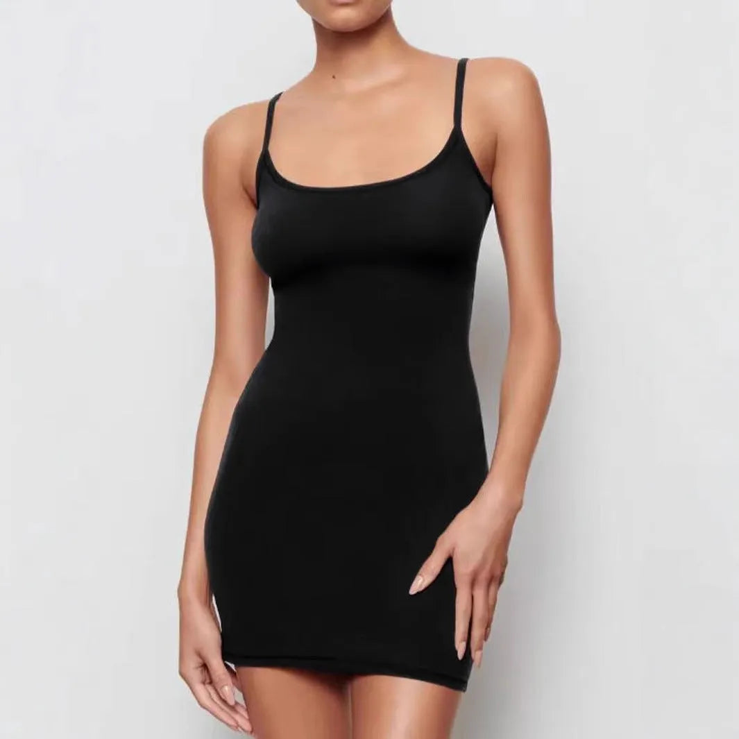 Black sleeveless sling dress with a slim sheath fit and short skirt.