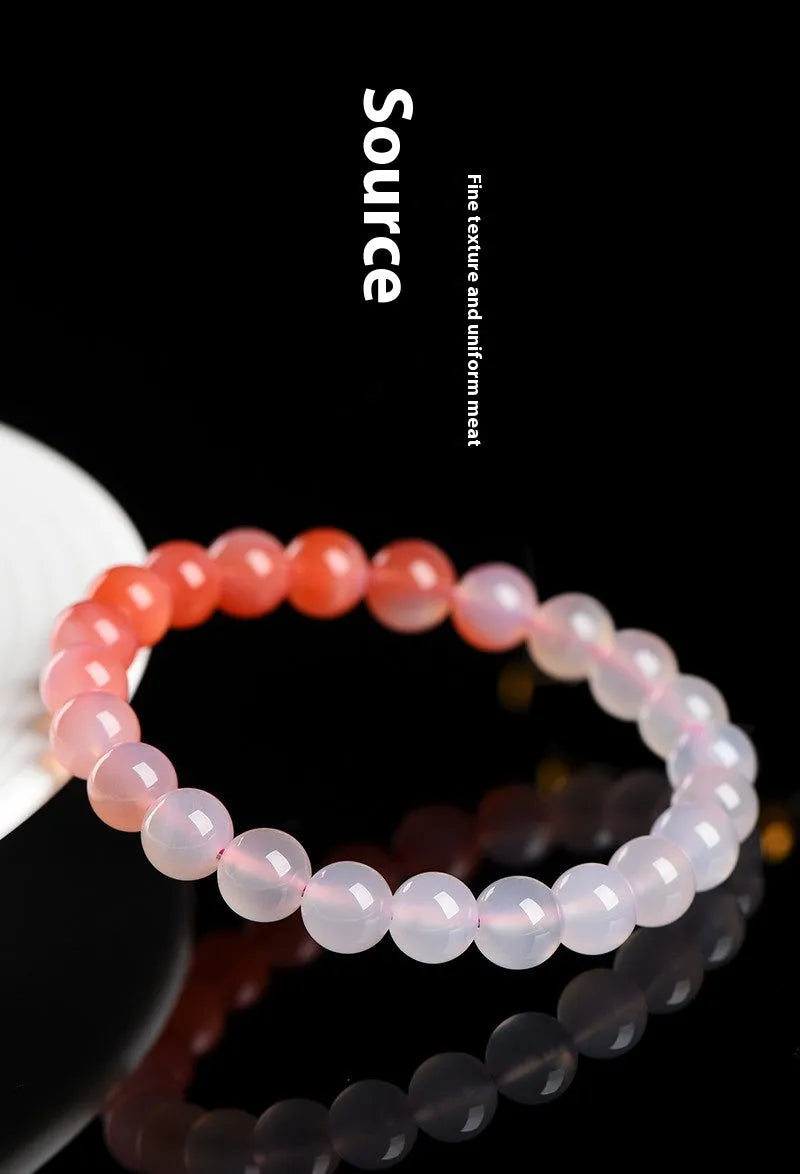 Yanyuan Agate bracelet with gradient salt source colour on wrist, showing geometry-shaped beads.