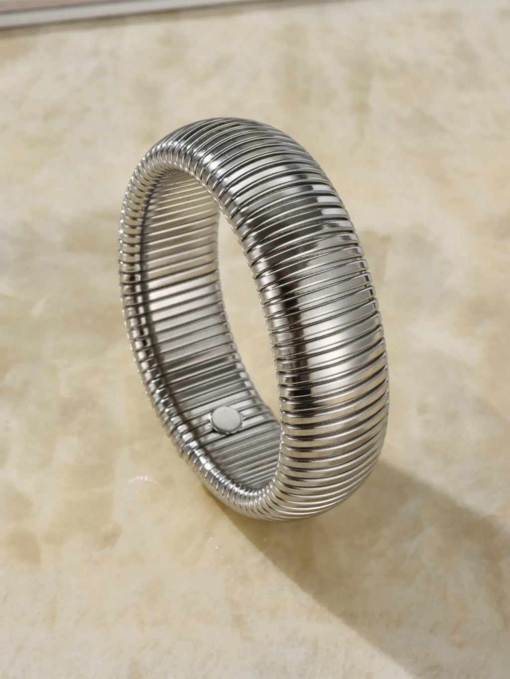 Women's elastic titanium steel bracelet with vertical stripe ring design in gold finish