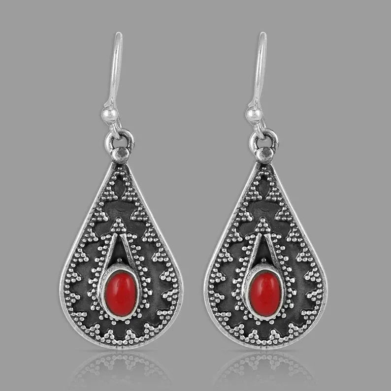 Silver drop-shaped retro earrings for women with red pine gemstone details on zinc alloy.