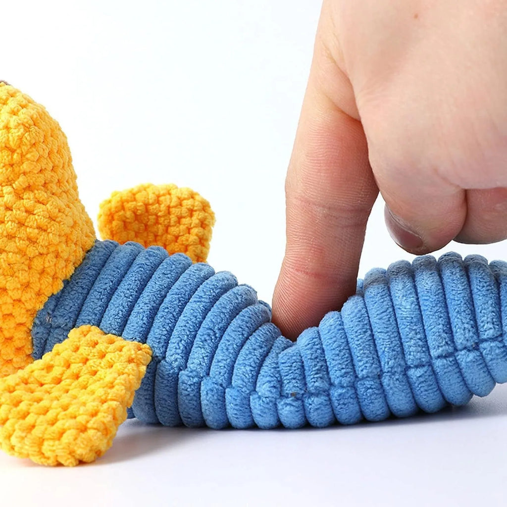 Squeaky stuffed animal dog chew toy for dental cleaning and play.