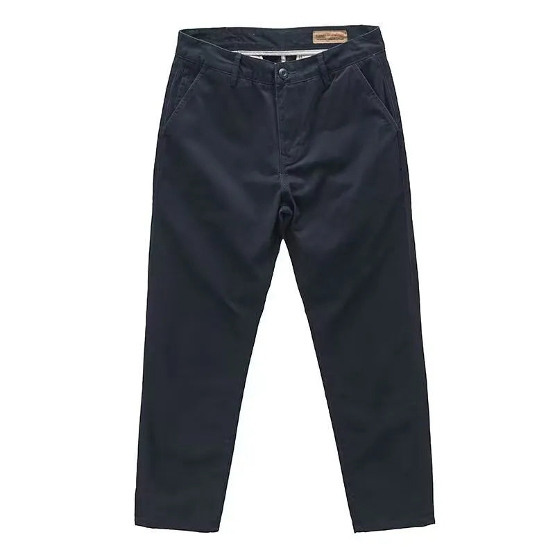 Man wearing slim-fit light straight-leg trousers in a micro-elastic washed fabric