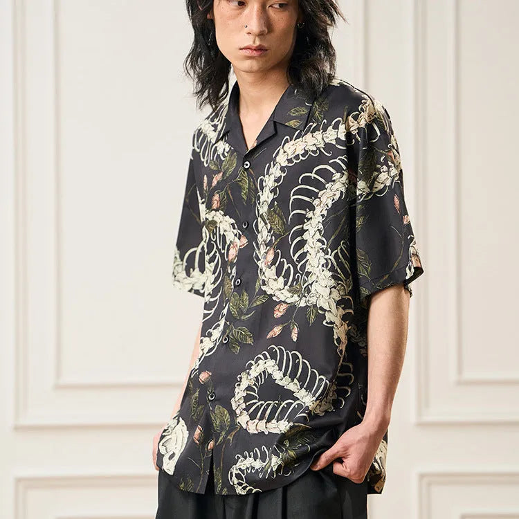Short sleeve Cuban collar shirt with a snake bone and floral printed pattern in a loose fit.