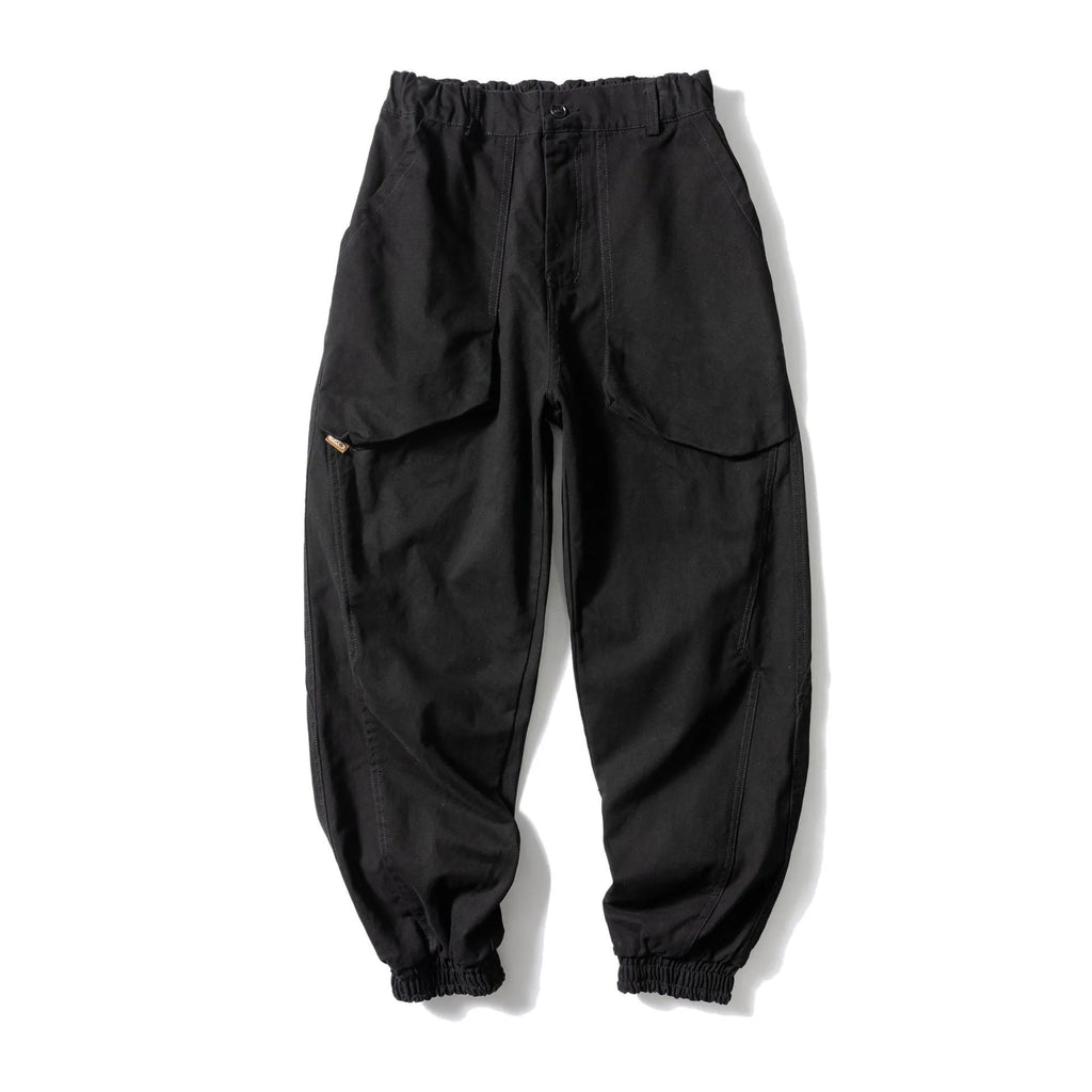 Black cotton tapered casual pants with ankle tie and large pocket.