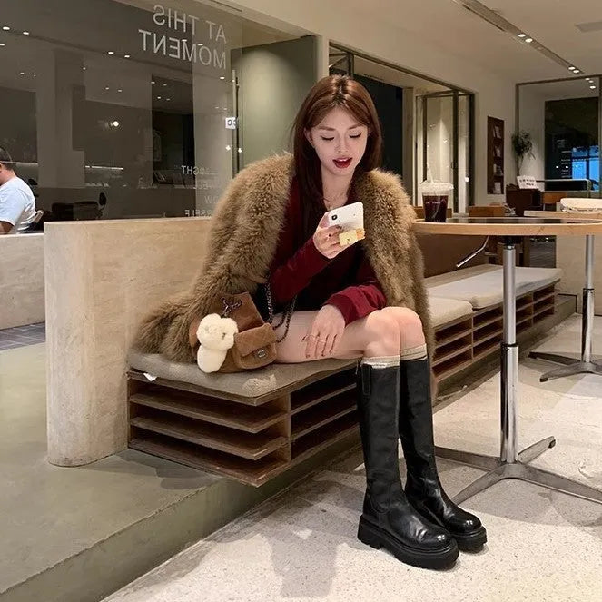 Black and brown women's long tube knight boots with chunky heel and back zipper.