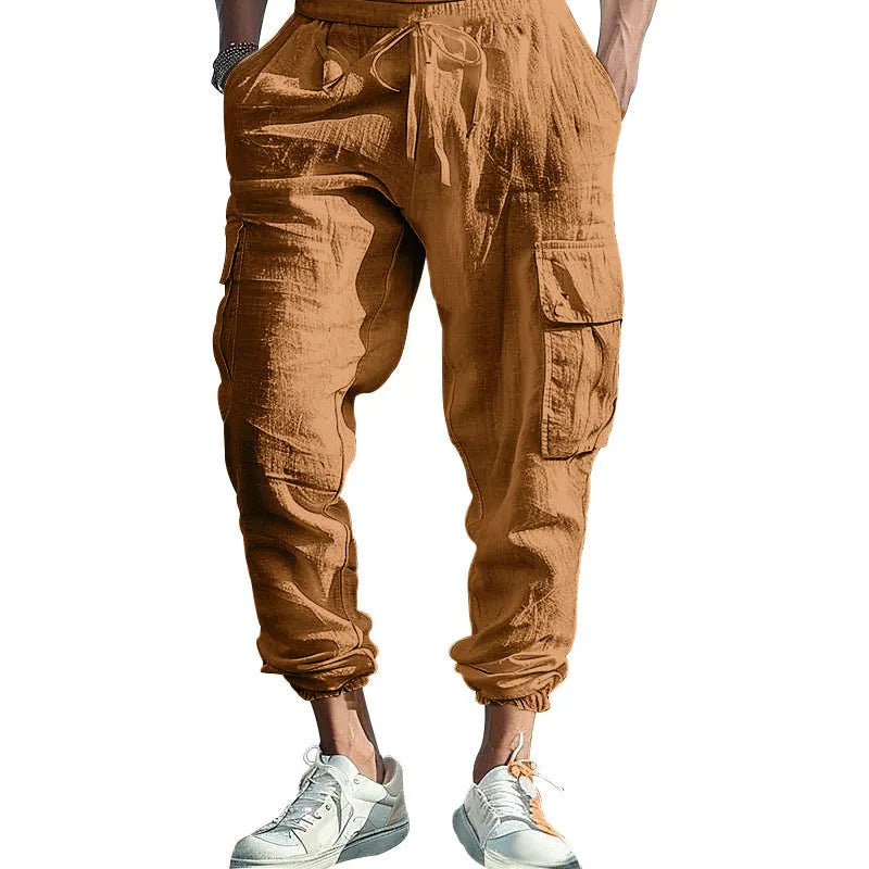 Men's linen casual trousers with ankle-tied cuffs and multiple pockets in a solid colour.