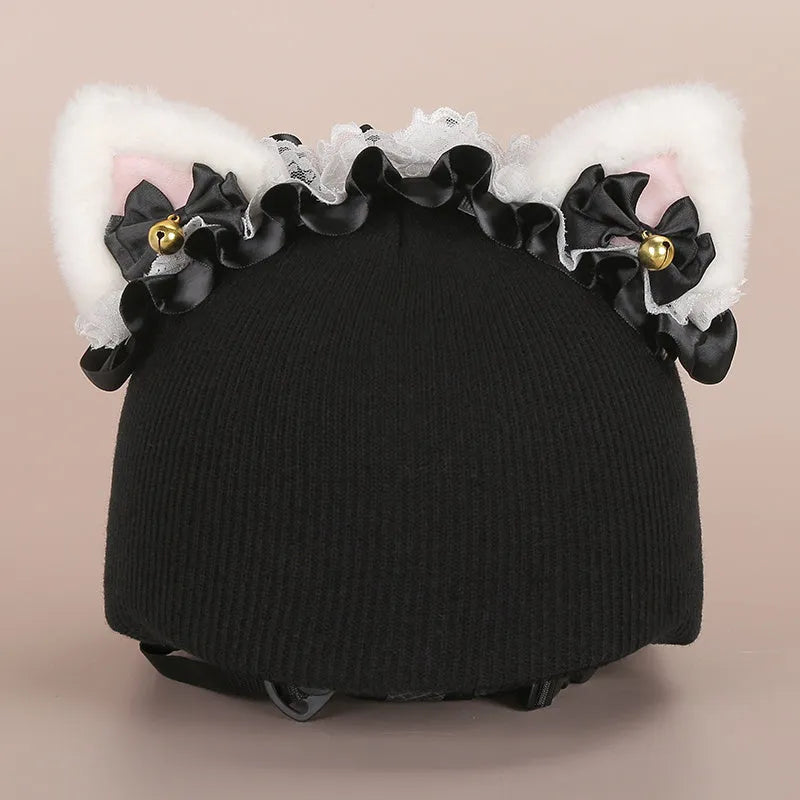 Plush cartoon-themed cover set on a medium motorcycle helmet with soft ear decorations.