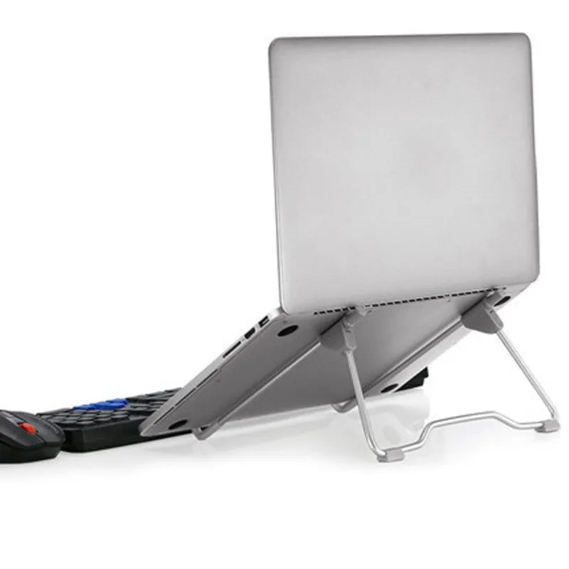 Grey aluminium alloy mobile phone and laptop stand on wooden desk