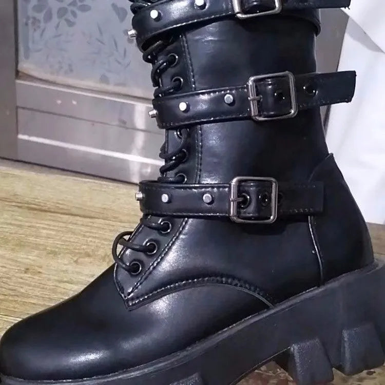 Women's black mid-calf knight boots with large metal buckle and side zip on a white background.