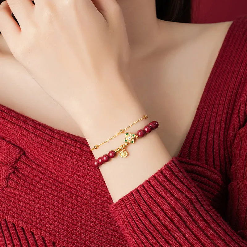 Sterling silver women's bracelet with geometric shape, Ruyi Xiangyun design, and cinnabar flower detail.