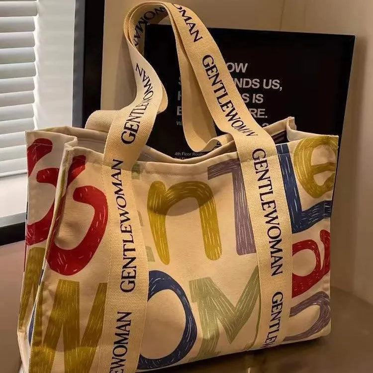 Canvas women's tote bag with printed pattern and shoulder strap design