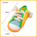 Yellow plastic dog slipper toy with a squeaker for chewing.