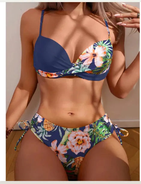 Women's green push-up bikini top and matching split drawstring briefs laid flat.