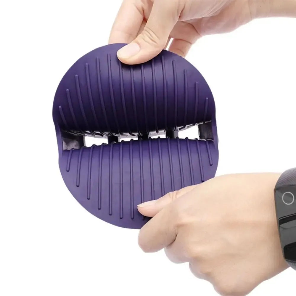 Purple dual-sided pet shampoo and massage brush with soft TPR bristles and ergonomic handle.