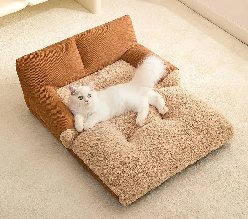 Small brown and grey fabric dog kennel bed with a plush cushion inside, showing its non-slip base.