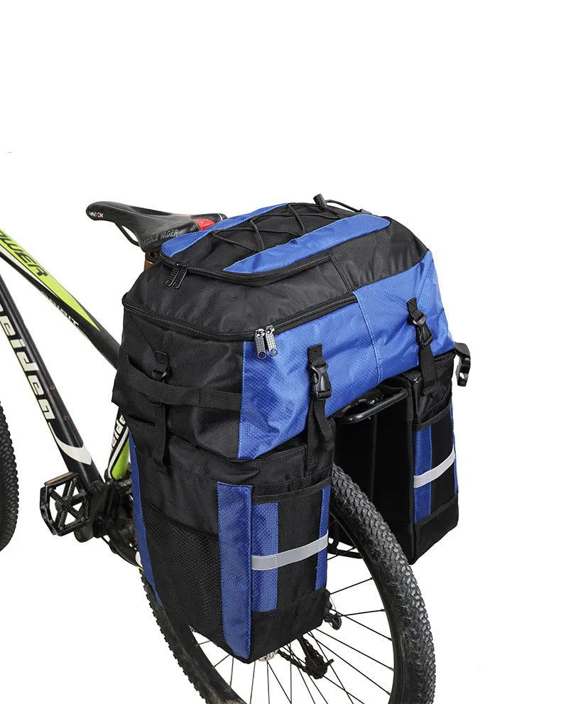 Green bicycle rear storage bag with 70 litre capacity mounted on a bike rack for touring.