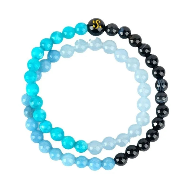 Handmade double ring crystal bracelet in five elements colours on a wrist.