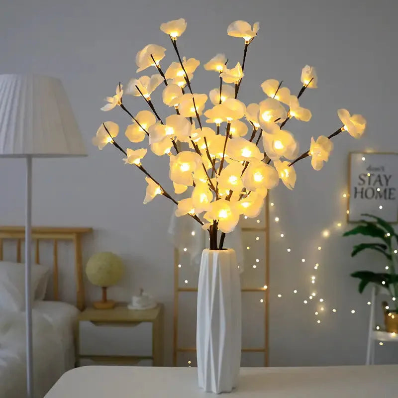 Pink LED phalaenopsis orchid branch decorative light on a table