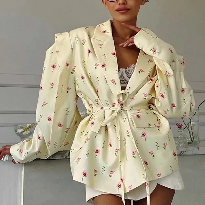 Printed collar suit jacket with lace-up front detail in apricot, shown on a hanger.