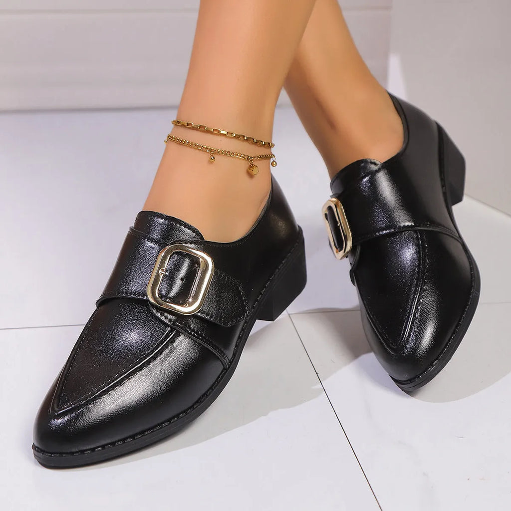 Women's casual leather shoes with a decorative bow on a pointed toe, showcasing a rubber sole.