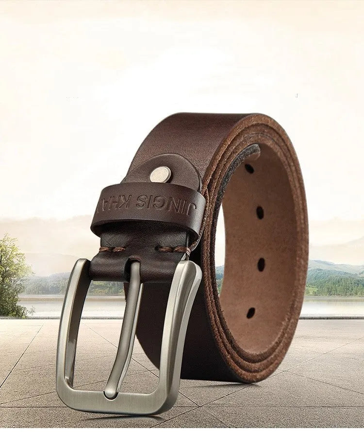 Handmade casual men's cowhide belt with needle buckle and leather decoration, black colour, on a plain background