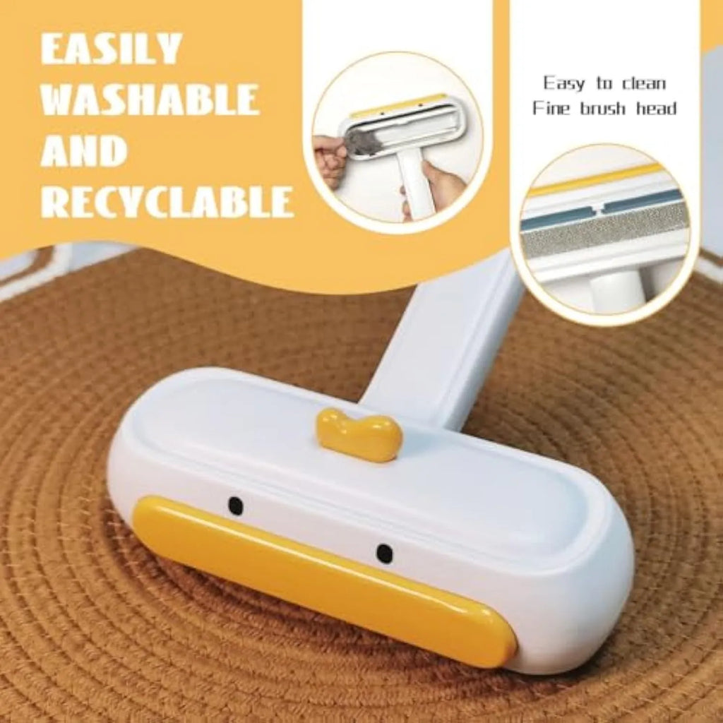 Yellow duck design portable pet hair remover brush with plastic body and polyester bristles.