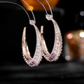 Women's large geometric copper hoop earrings with zirconium stone accents in five colour options.