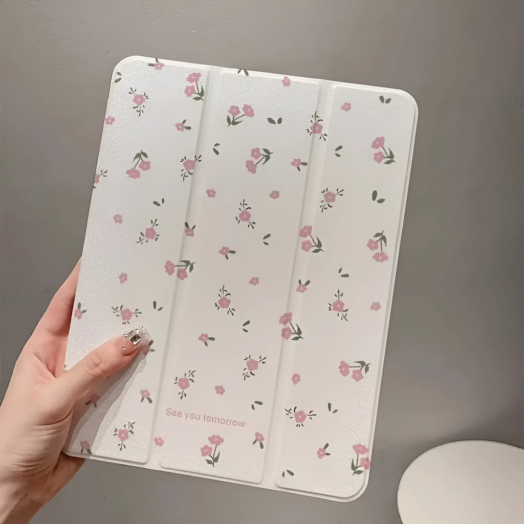 Transparent floral tri-fold iPad protective case showing magnetic stand function and cartoon design