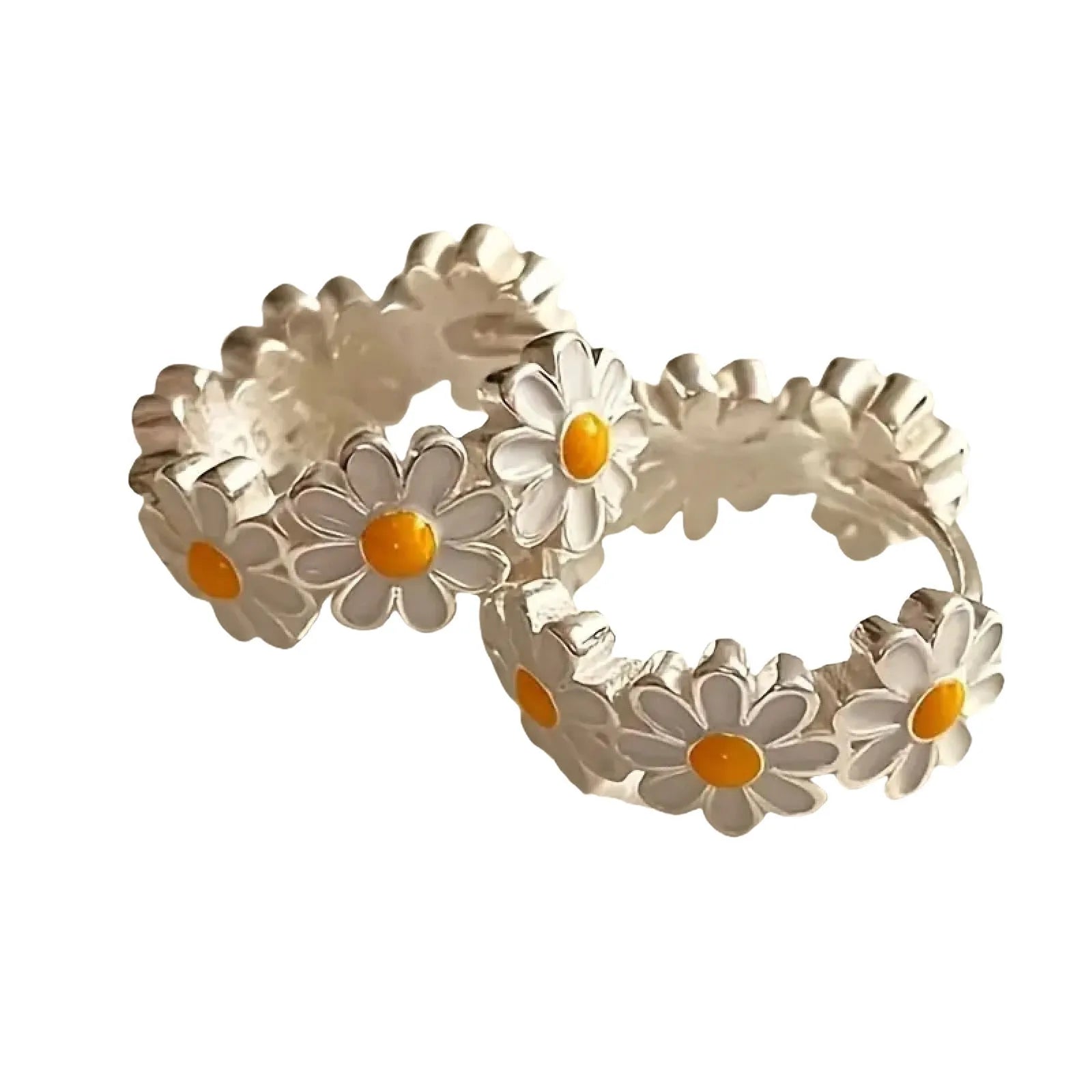 White daisy flower copper earrings with platinum gem accents on display
