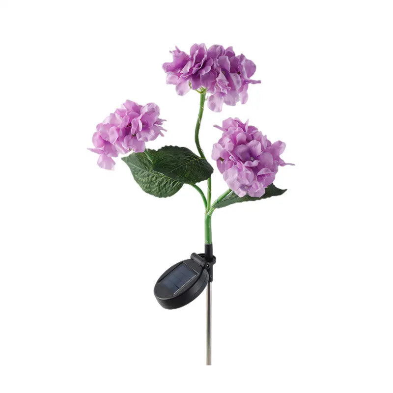 Solar hydrangea garden lights with plant-shaped design and floor outlet base in outdoor setting