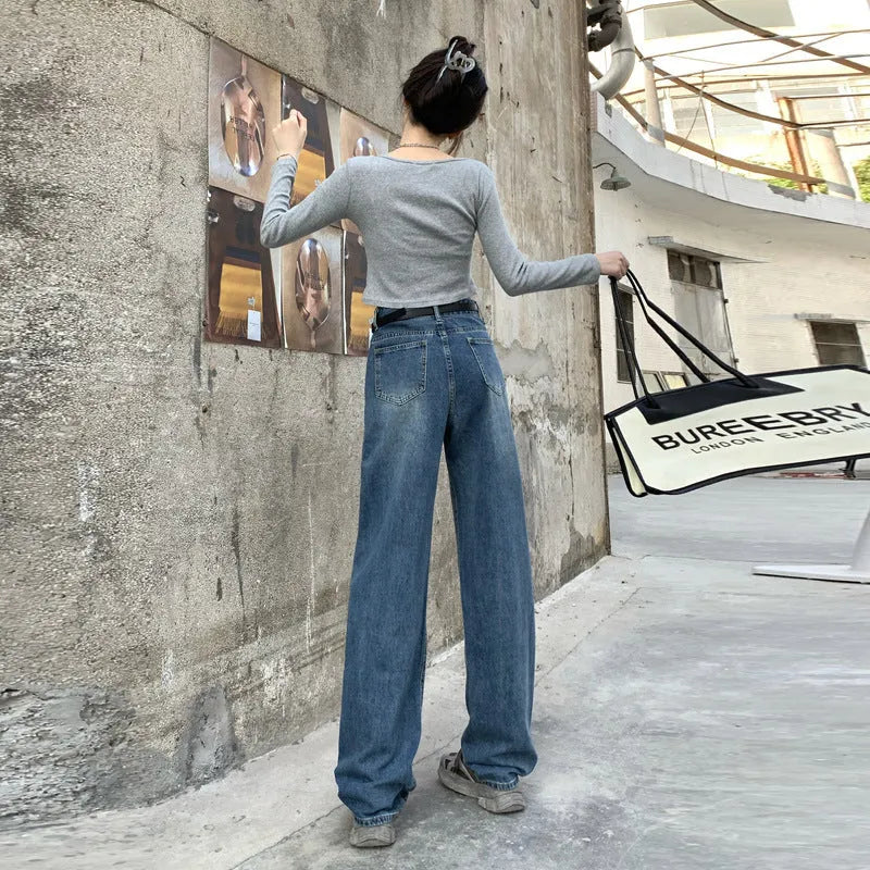 Women's high waist straight leg jeans in retro blue denim, shown on a model.