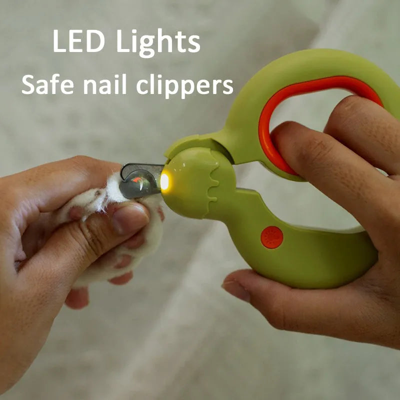 Blue pet nail clipper with LED light on, showing ergonomic handles and stainless steel blade.