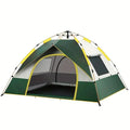 Dark green and silver 3-4 person quick open camping tent with guylines pegged out.