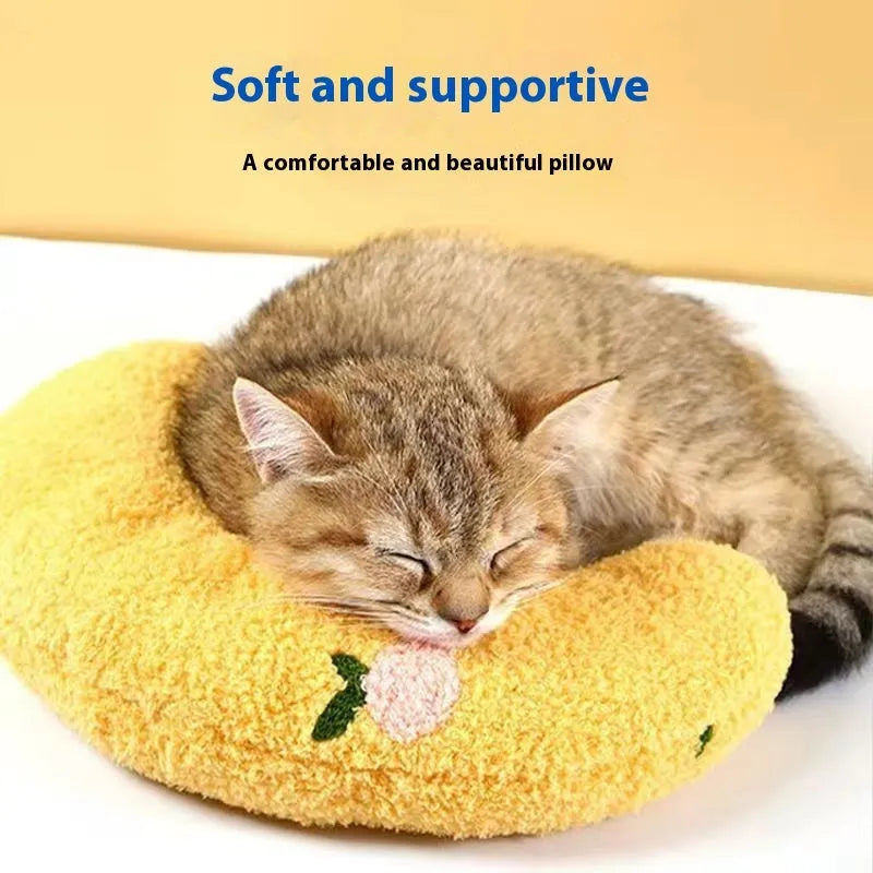 Blue U-shaped cat pillow in question mark style on a white background.