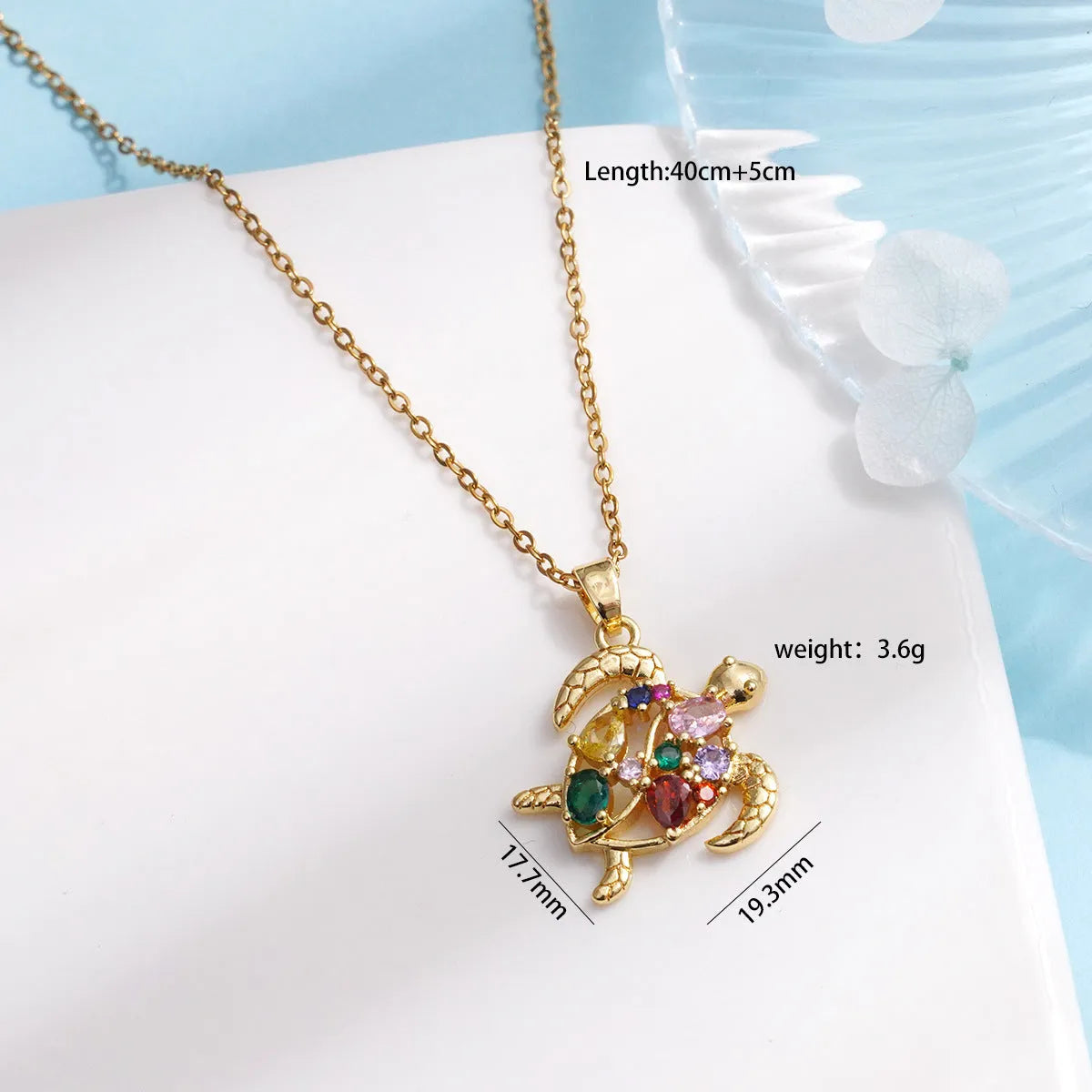 Gold-plated copper sea turtle pendant necklace with mixed gemstone inlay and zirconium encrustation on titanium steel chain