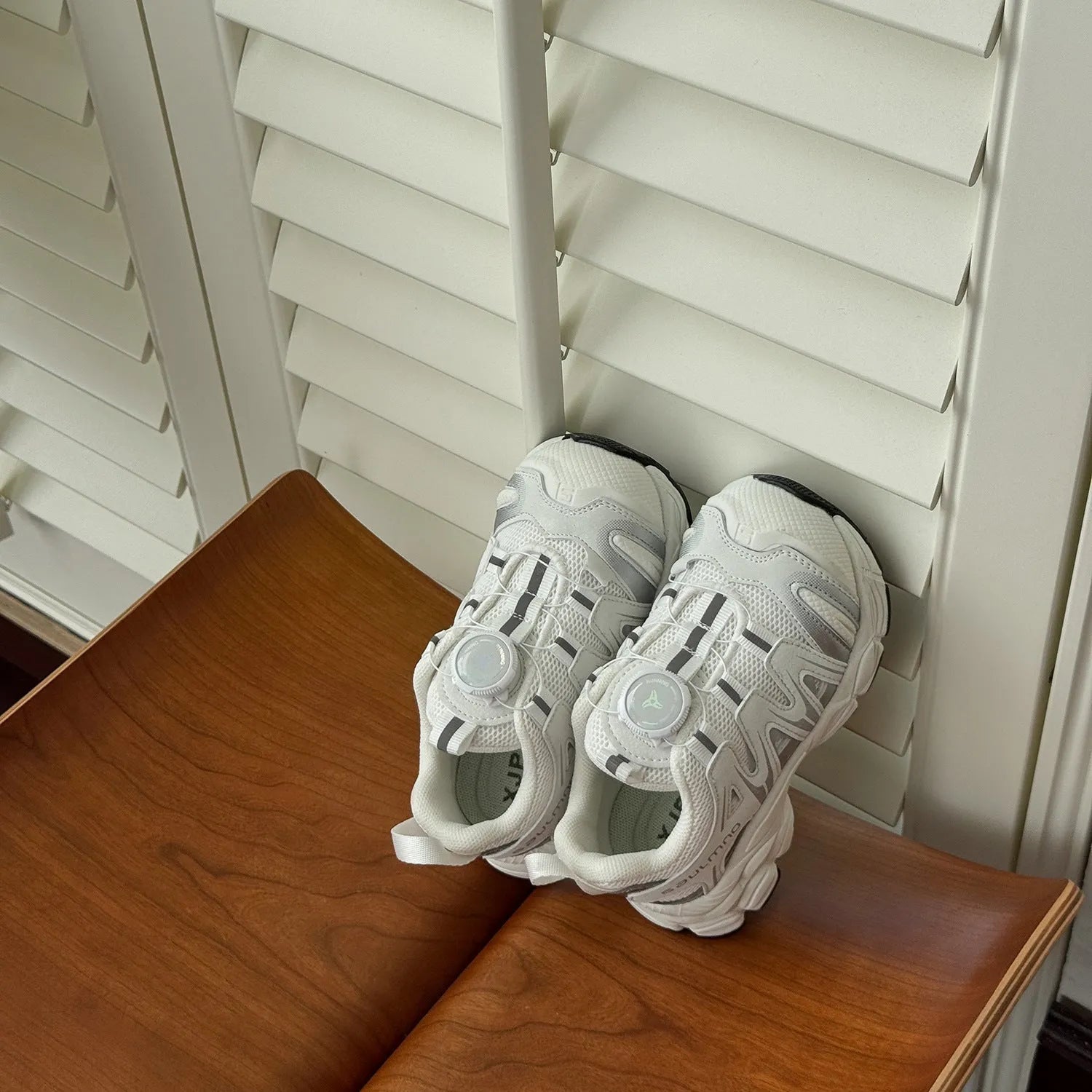 Lightweight casual shoes in black, beige, or pink with a breathable PU leather mesh upper.