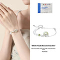 Silver peach blossom charm bracelet with peace buckle closure in New Chinese style