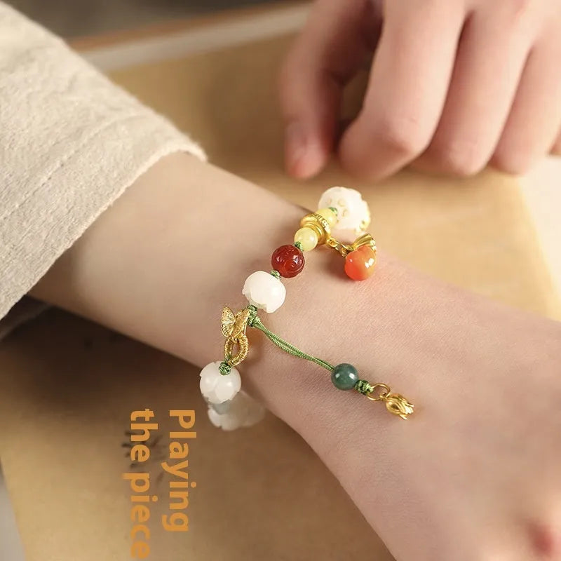 White jade Bodhi bracelet with hand-woven lotus and pumpkin beads on open rope design