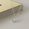 Silver 925 ornamental stone necklace with geometric pendant on a curb chain.