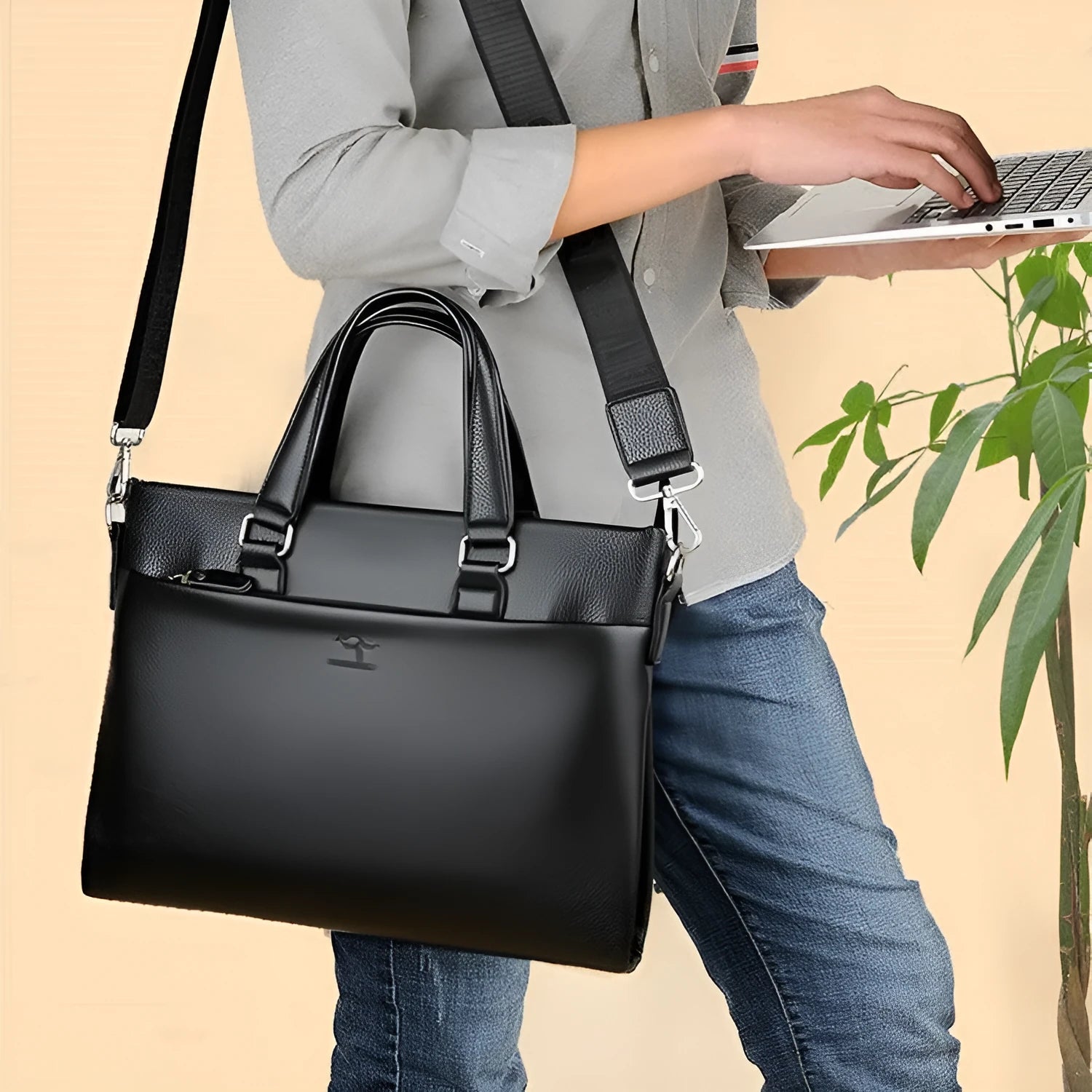 Black PU leather men's messenger bag with shoulder strap showing splicing design details