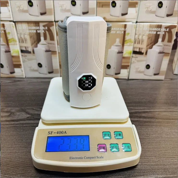 Grey and white car charger electric milk warmer for baby bottles on a car seat.