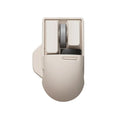Tofu coloured Xiaoqiao wireless mouse on a desk, showing its ergonomic shape and seven buttons.