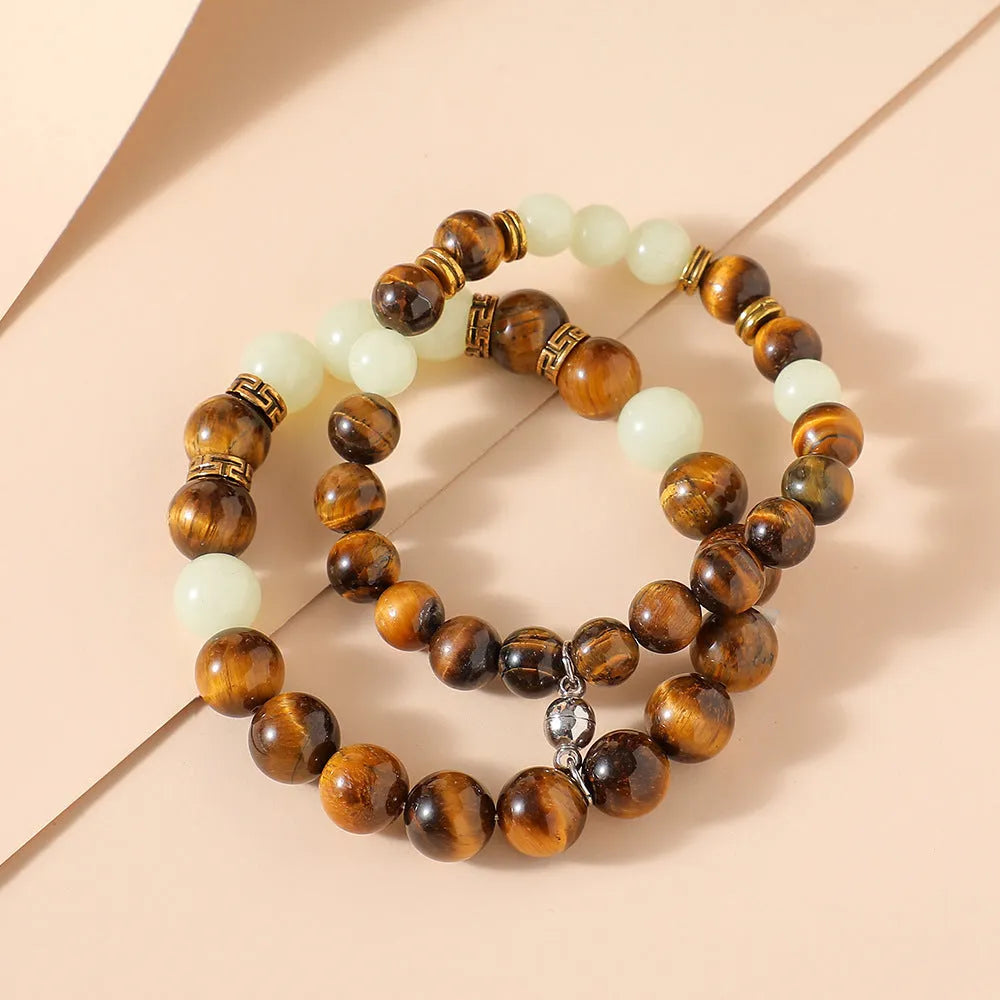Geometric couple bracelets in luminous amber colour with retro fashion styling