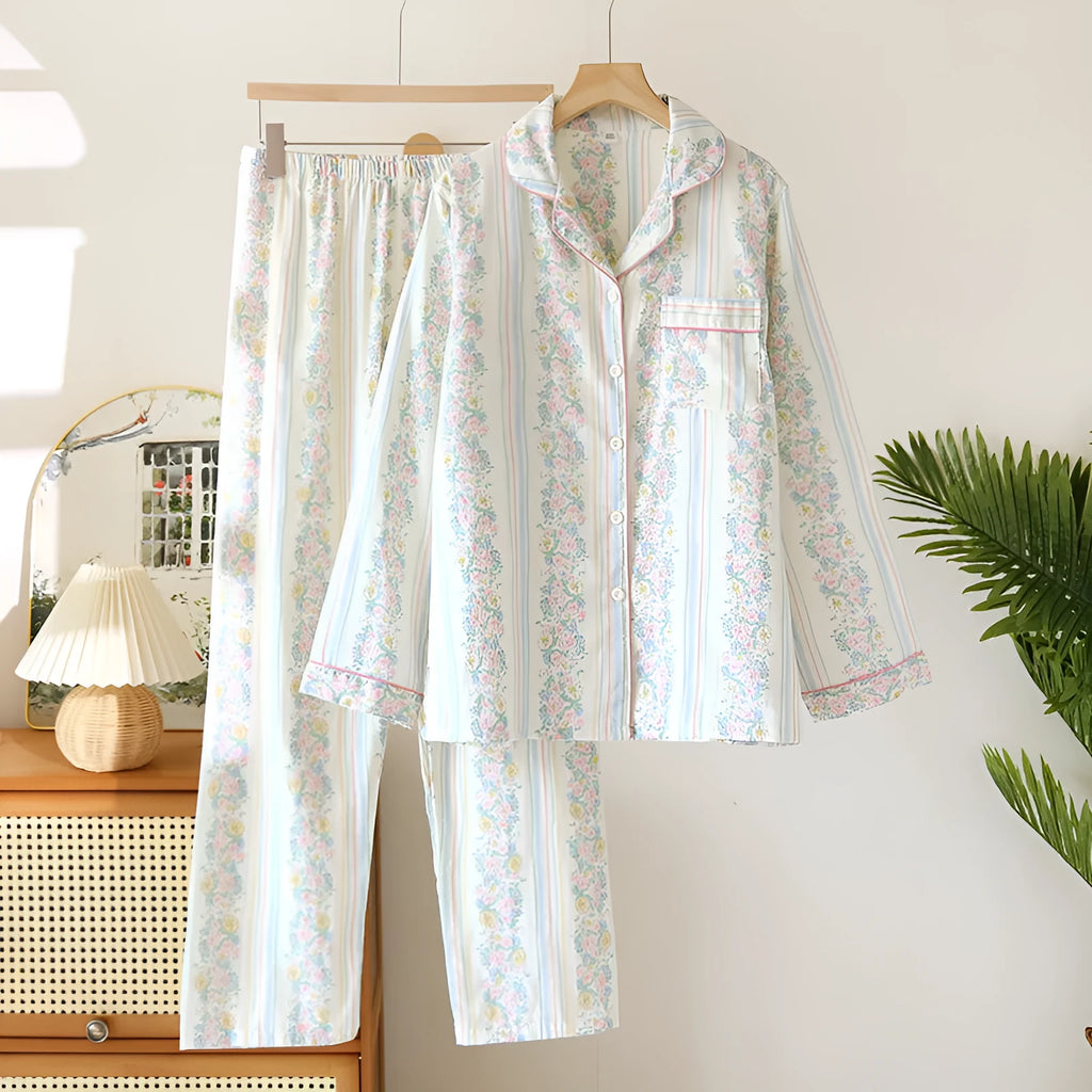 Women's red fruit print cotton gauze long-sleeved top and trousers two-piece lounge set laid flat.