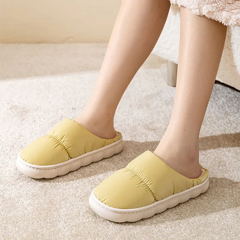 Blue down cotton slippers with thick rubber sole and plush lining, shown from side.