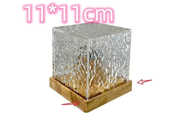 USB-powered crystal table lamp projecting blue water ripple light patterns on a wall